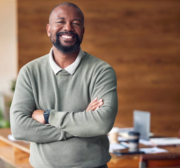 Business, confidence and portrait black man with smile in office, startup ceo or owner at hr company. Happiness, project management and happy, confident professional businessman at recruitment agency